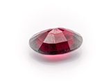 a close up view of a red diamond on a white background