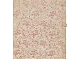 an old book with a floral pattern on it