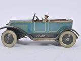 a blue toy car with a man in the driver seat