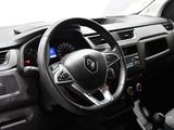 the interior of a car with a steering wheel and dashboard controls