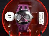 a purple watch in a red case on a black surface