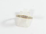 a close up of a gold ring with diamonds on a white background
