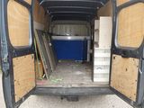 a van that has been vandalized with plywood floors