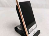 a cell phone that is sitting on a stand