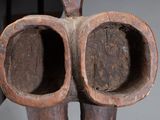 a wooden sculpture of a pair of scissors on a table