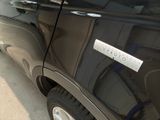 a close up of a car door with a sticker on it