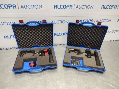an image of two blue cases with tools in them on a table