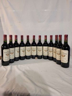 several bottles of wine are lined up on a table