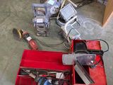 a red box with tools in it sitting on the floor