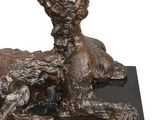 bronze statue of a dog and a cat on a black base