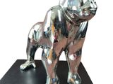 statue of a silver dog on a black base