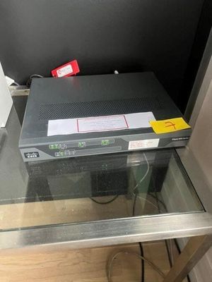 an image of a glass table with a laptop on top of it