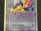 a close up of a pokemon card on a table
