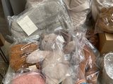 a pile of stuffed animals and other items on a table