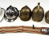 five different types of helmets and a hat on a table
