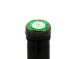 a bottle of wine that has a green label on it