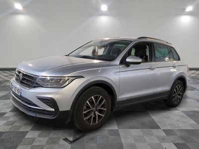 a silver volkswagen suv parked on a checkered tile floor