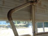 a pipe attached to the ceiling of a building