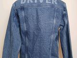 the back of a denim jacket that says driver on it