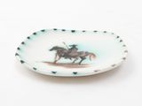 a picture of a plate with a picture of a man on a horse on it