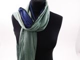 a green and blue scarf on a mannequin mannequin mannequin mannequin mannequin mannequin mannequin mannequin mann