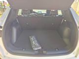 the trunk of a car with a remote control in the trunk