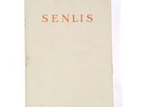 a white book with a red writing on it