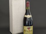 a bottle of wine next to a box of wine