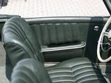 a view of the interior of a car from the driver ' s seat