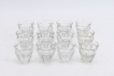 a lot of glasses that are sitting on a table