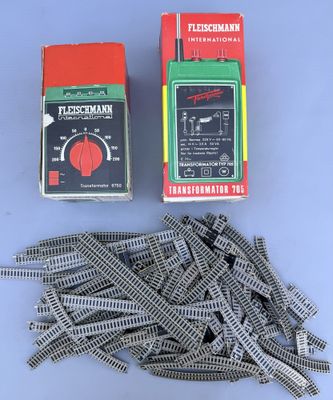 a box of train tracks next to a box of train tracks