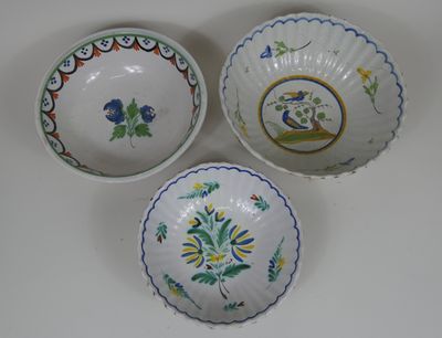 three different types of bowls with designs on them on a white surface