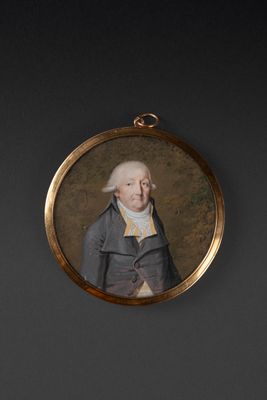 Miniature ronde figurant un homme au gilet rayé jaune sur fo…