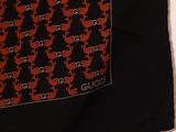 a black shirt with a red and black pattern on it