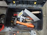 many tools in a tool box on the ground
