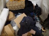 a pile of clothes and other items on the floor