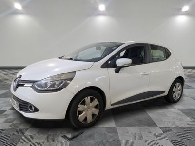 the white car is parked on a checkered tile floor