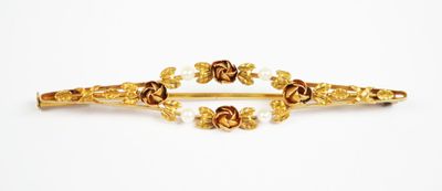pair of gold tone hair clips with flowers and pearls