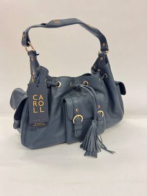 a blue handbag with a tag and tassel on it