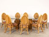 an image of a dining table with six chairs and a glass top