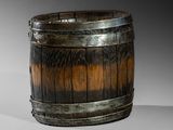 a wooden barrel that is sitting on a table
