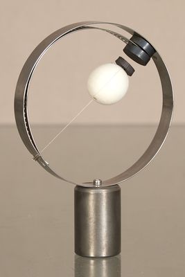 a metal object with a white ball inside of it