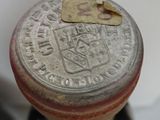 a close up of a metal object with a tag on it