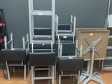 a lot of chairs and a table in a room