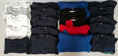 many t - shirts laid out on a white table