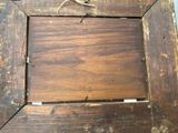 a picture of a wooden picture frame with a lizard on it