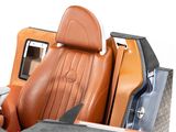 a close up of a car seat with a cell phone in it
