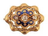 an image of a gold and blue flower broochle with diamonds