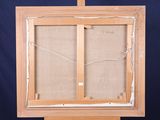 an old wooden easel with a piece of fabric on top of it