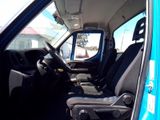 a picture of a blue van with black seats and a steering wheel